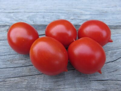 Principe Borghese Five Principe Borghese tomato seeds photographed on wooden surface.