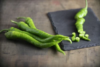 Sera_Demre_hot_pepper Fresh green Sera Demre hot pepper on slate