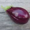 Shiny purple Topak Adana eggplant on wood