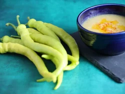 Corbaci 12 sweet pepper photographed next to a bowl of lentil soup.