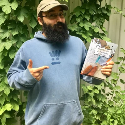 ben with book From Our Seeds & Their Keepers