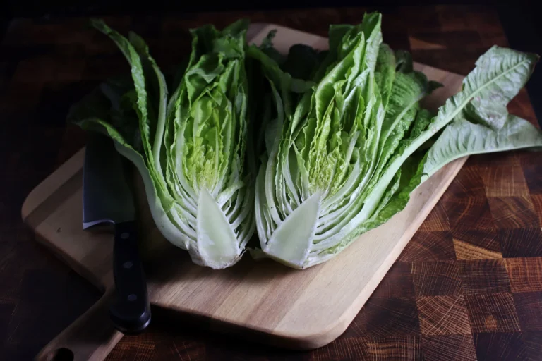 Halved Devil's Ear romaine lettuce on cutting board