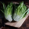 Les Oreilles du Diable1 Halved Devil's Ear romaine lettuce on cutting board