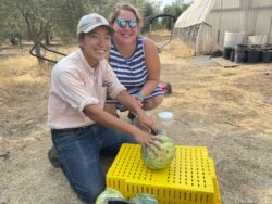 Farmer Kristyn Leach and Two Seeds in a Pod's co-owner Amy Thompson posing with Kırklareli Yellow watermelon.