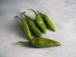 Sweet Balik peppers photographed on a backdrop with marble texture.