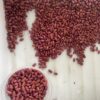 Bursa Gelin dry bean seeds scattered on the counter and poured into a bowl.
