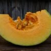 Adapazari GS2 Mature Adapazarı winter squash slice pictured on wooden box.