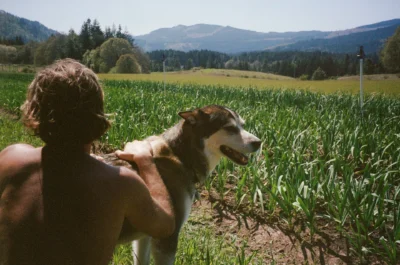 Moghadam Rocambole_2 Garlic, farmer Sasha Moghadam and Mooshi the dog pictured on the Husum, WA, farm