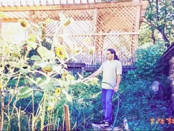 Jamshid Moghadam watering his home garden in Colorado